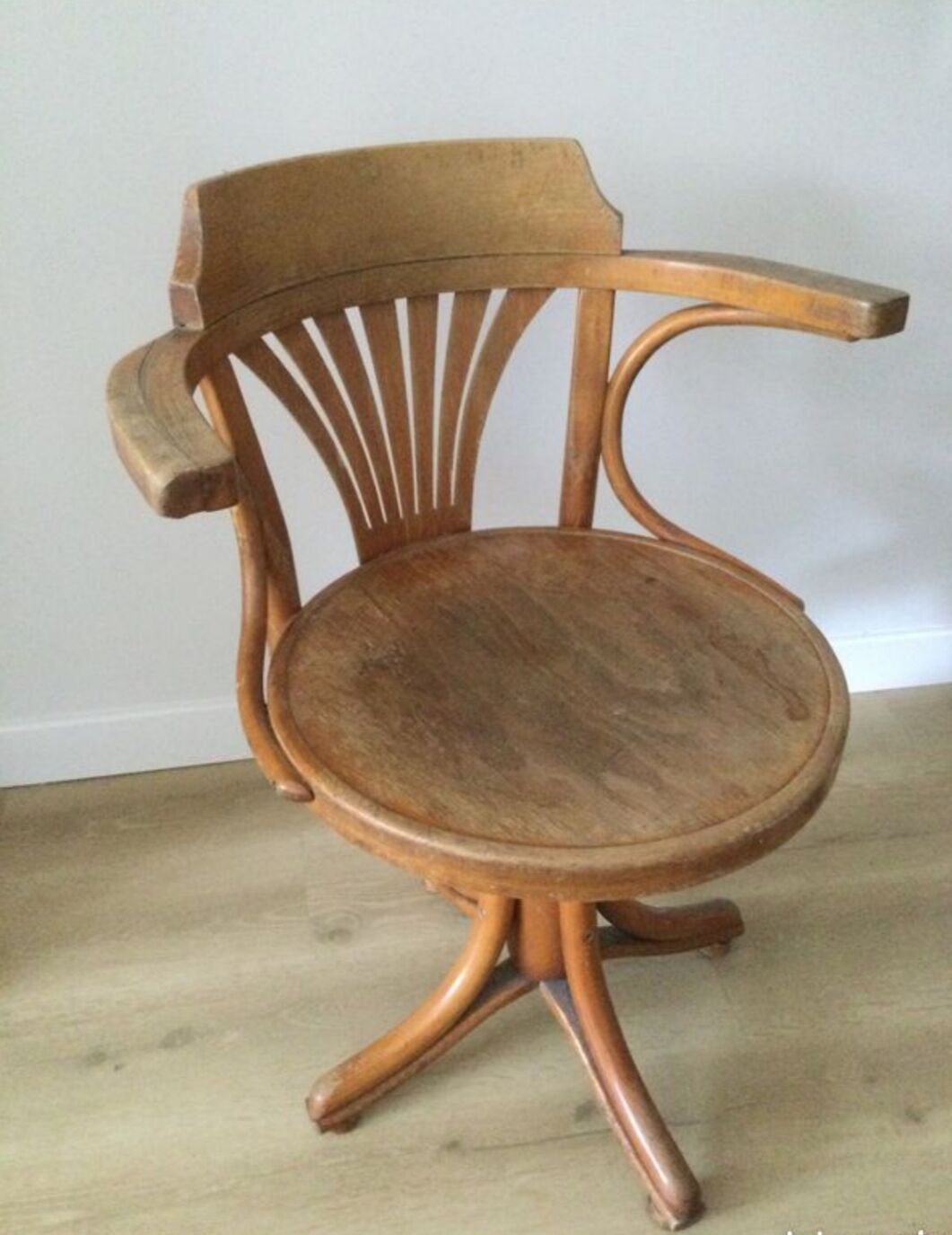 Swivel wooden armchair