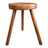 Three-legged wooden farm stool