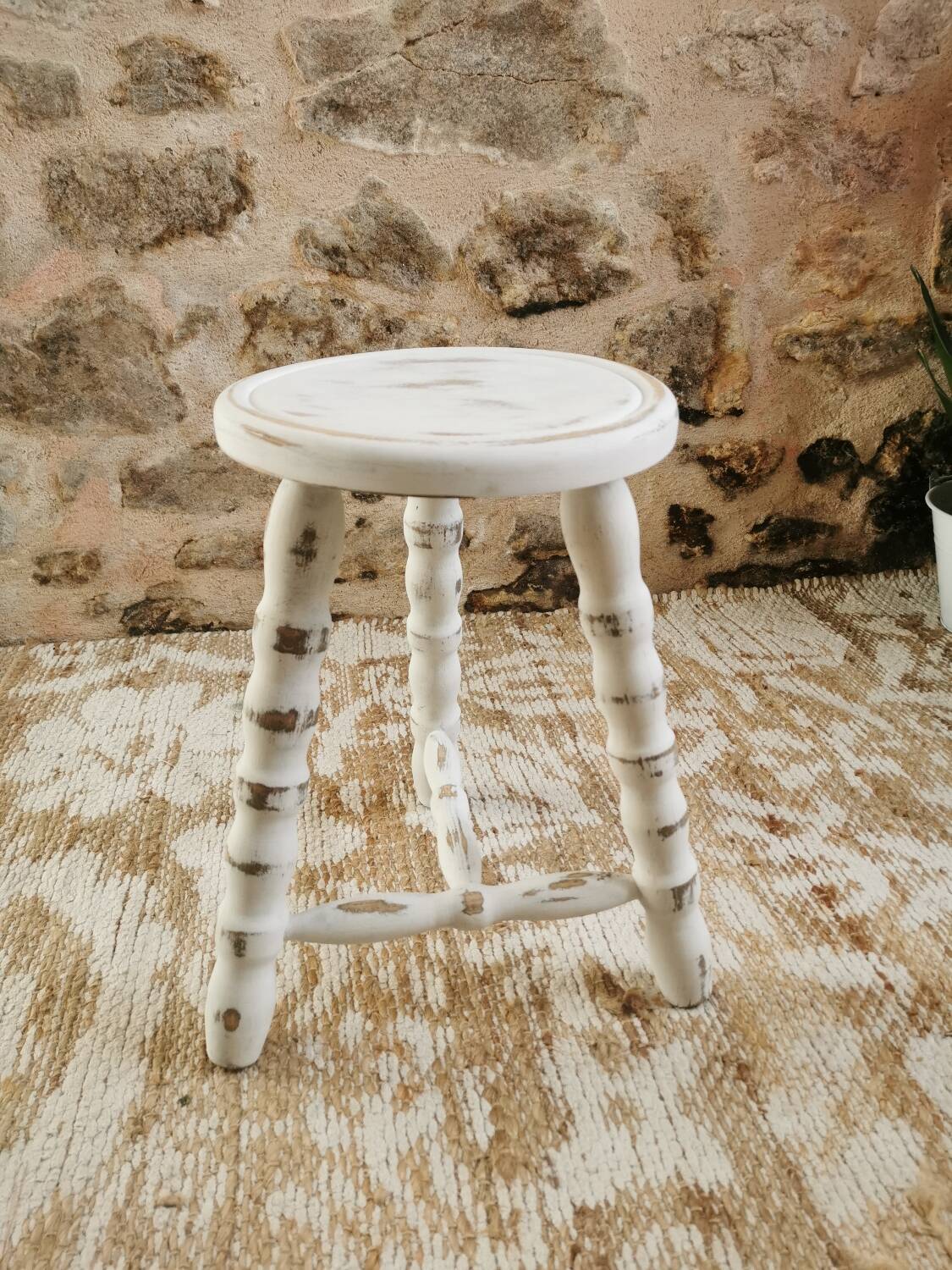 Tripod stool with patinated plant holder