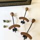 Trio of antique wooden and metal coat hooks
