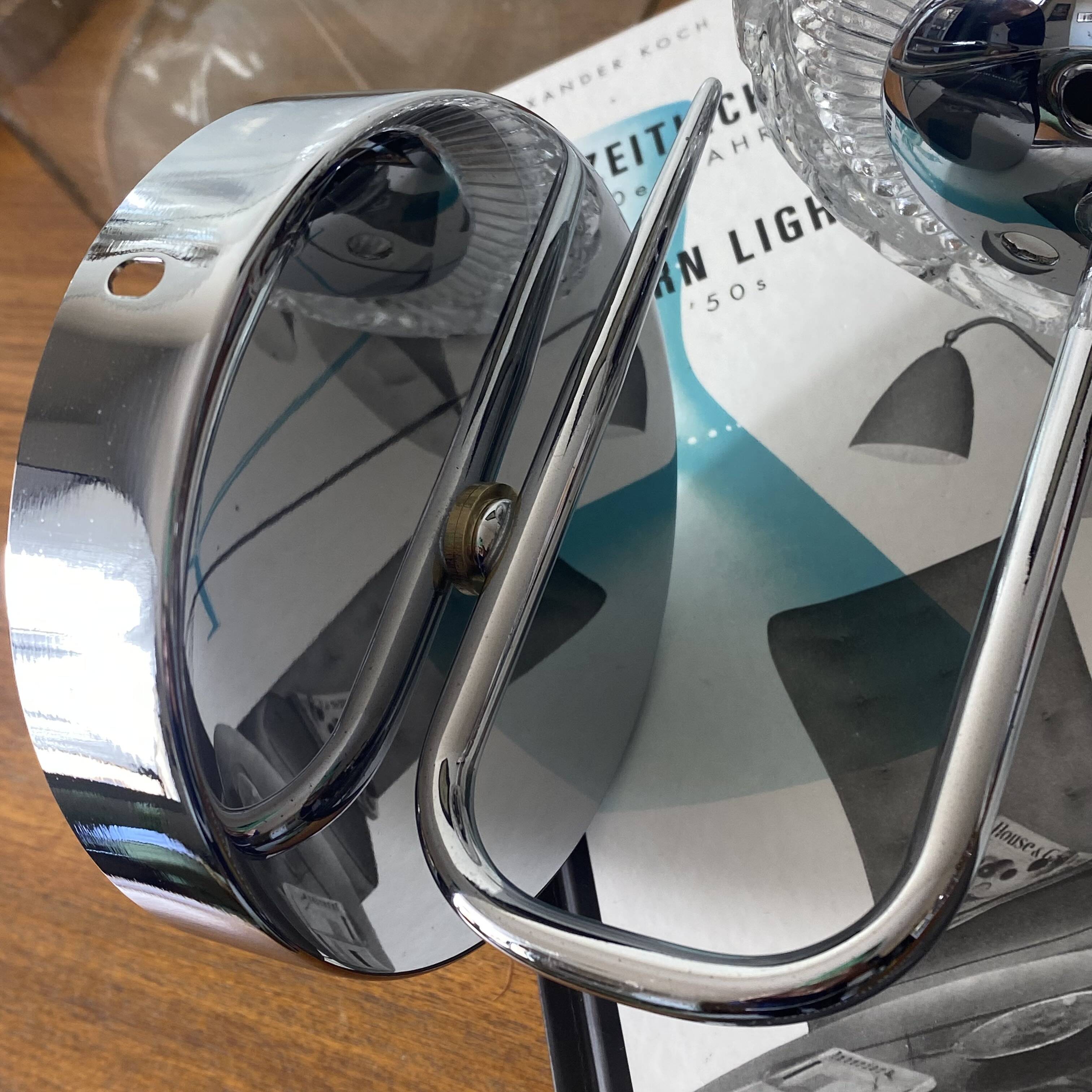 Swan neck wall light in stainless steel, thick glass shade, stainless steel rose.