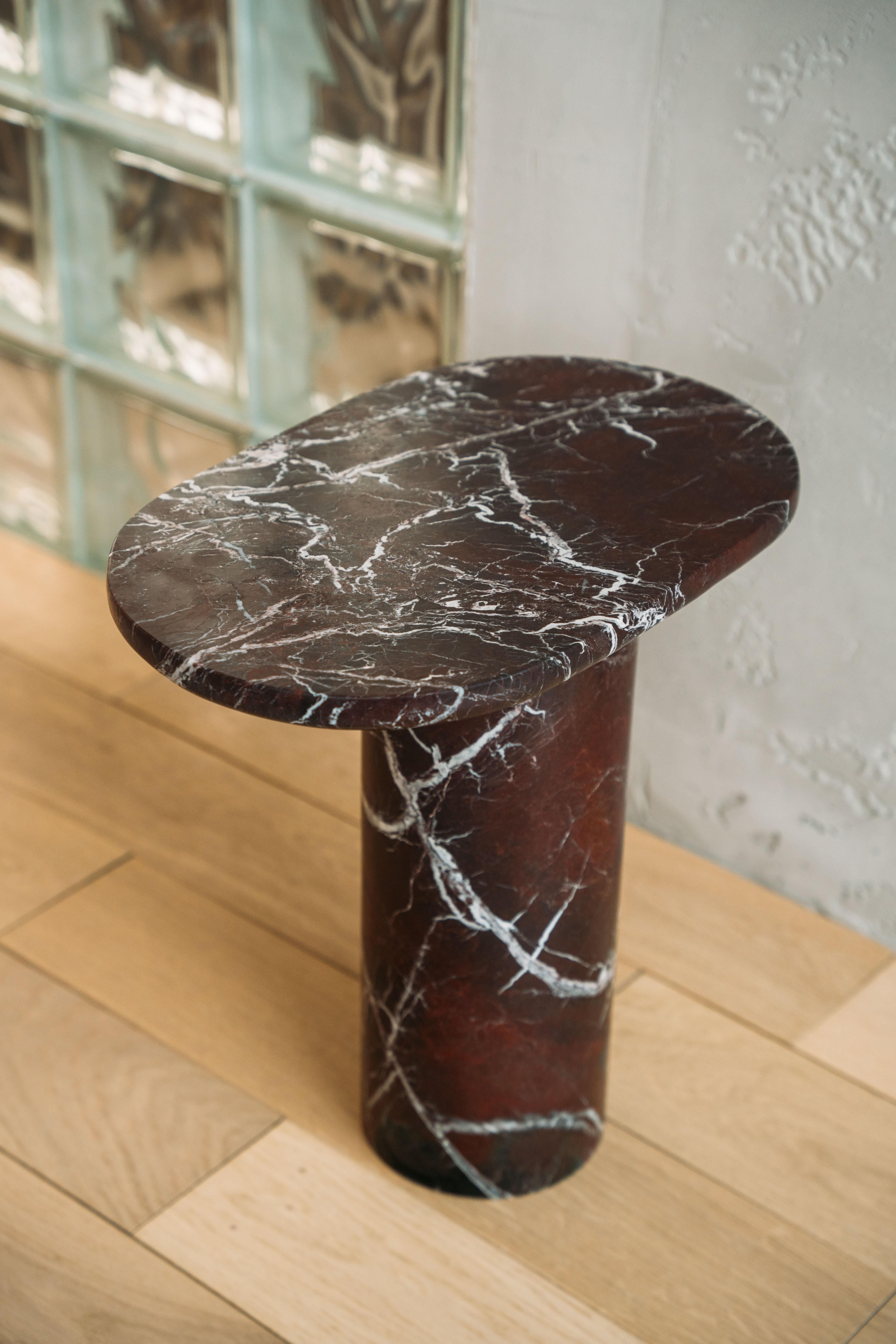 "Bold" side table in Rosso Levanto marble