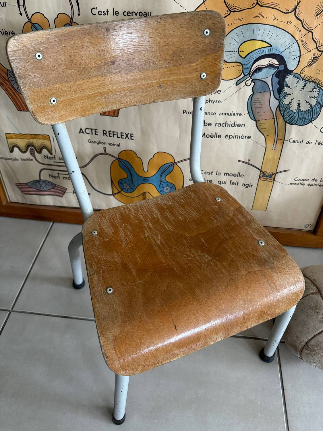 Old wooden and metal children's school chair