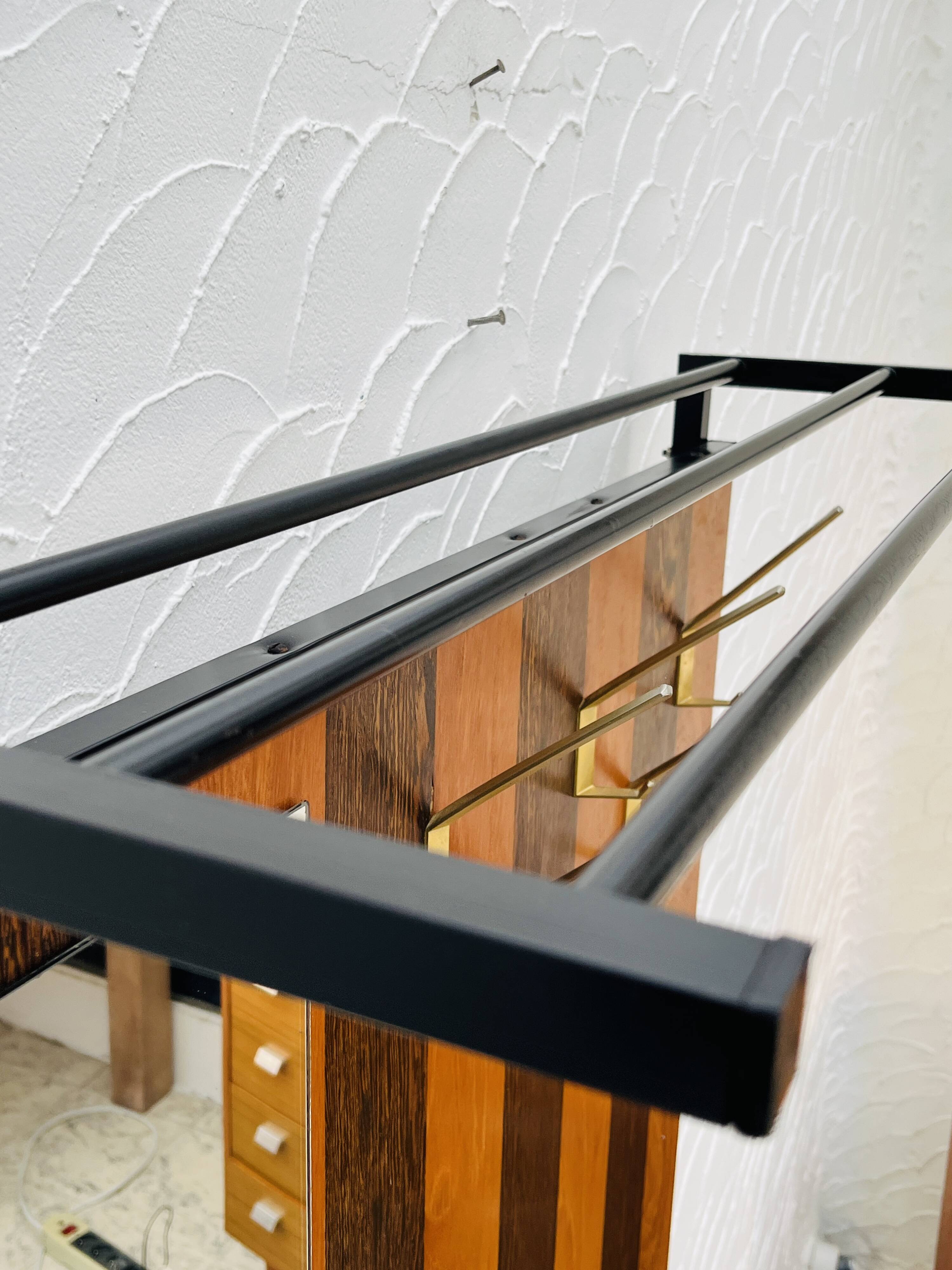 Vintage wall coat rack with storage bench from the 1970s.