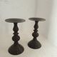 Two pairs of patinated brass candle holders