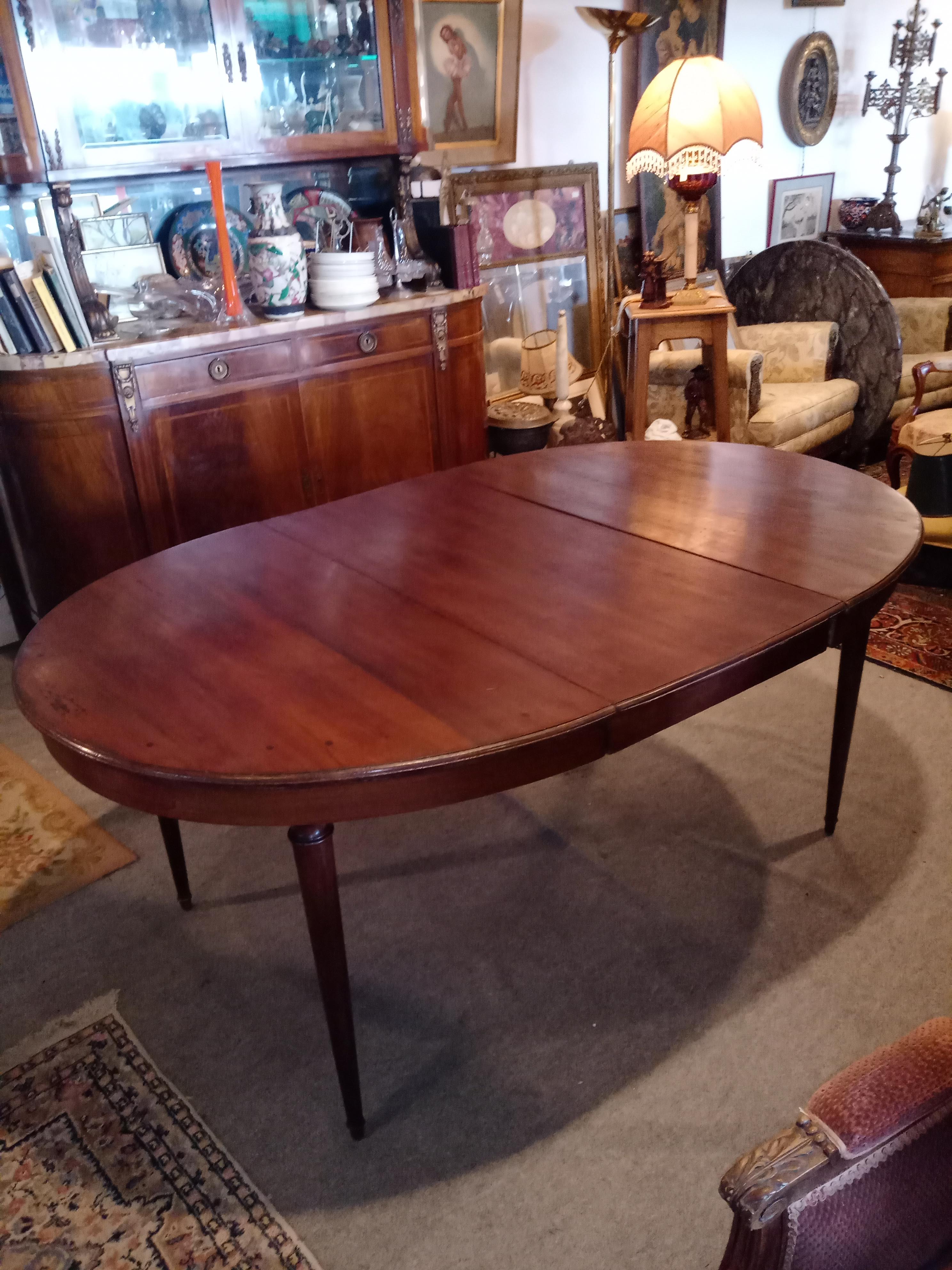 Oval mahogany table with extension cords