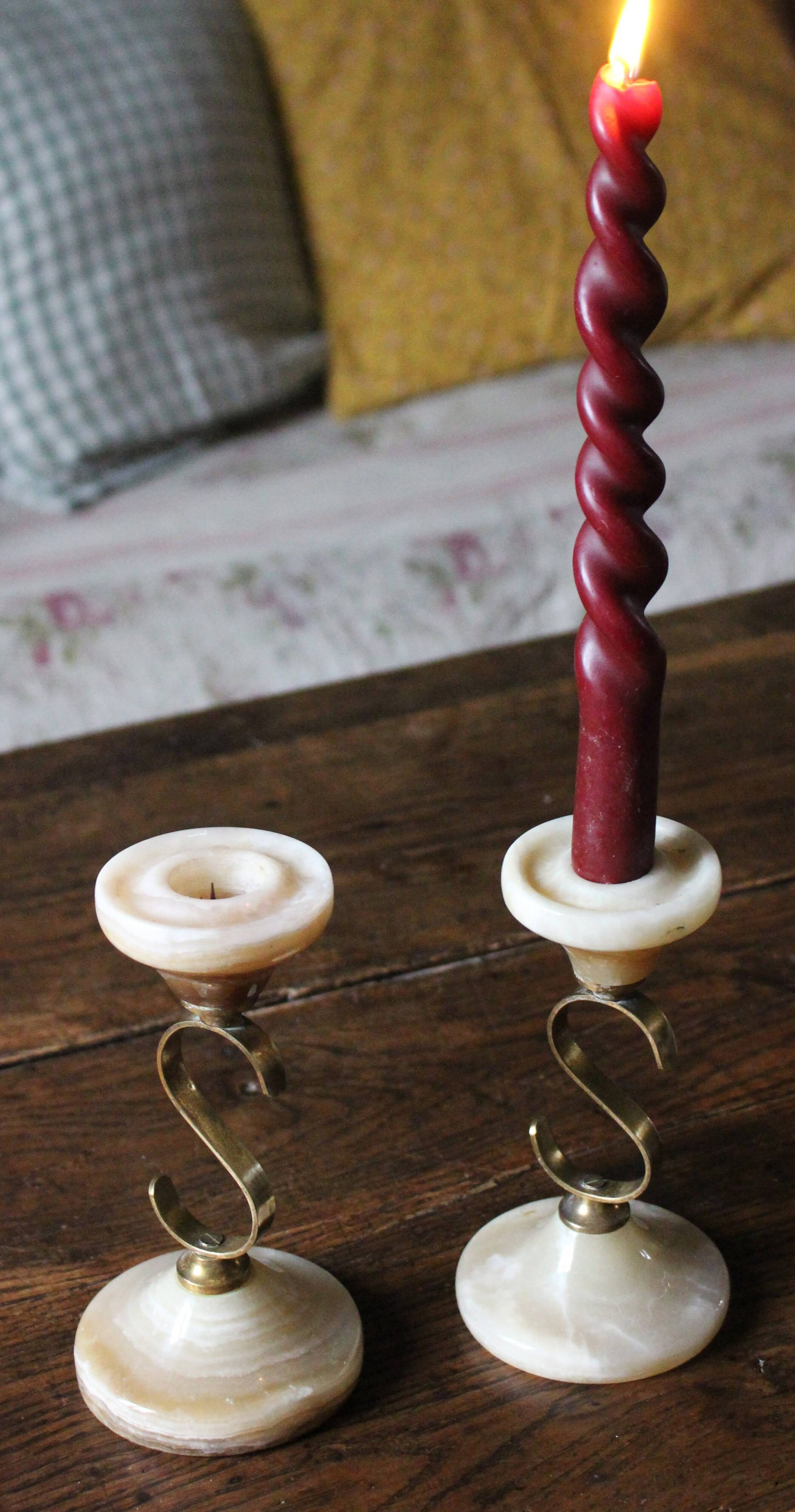 Pair of curved brass candlesticks with onyx