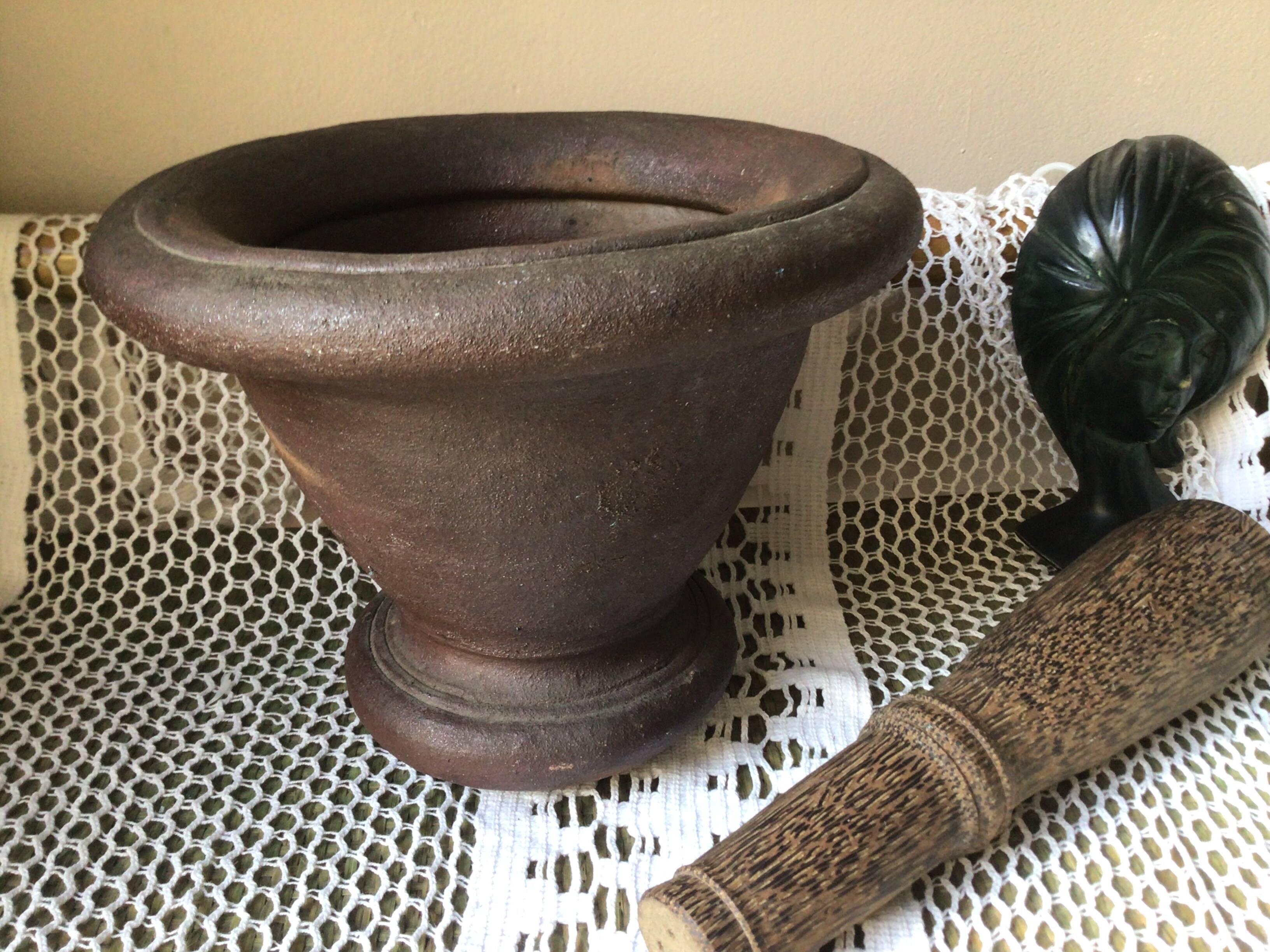 Cast iron mortar and wooden pestle