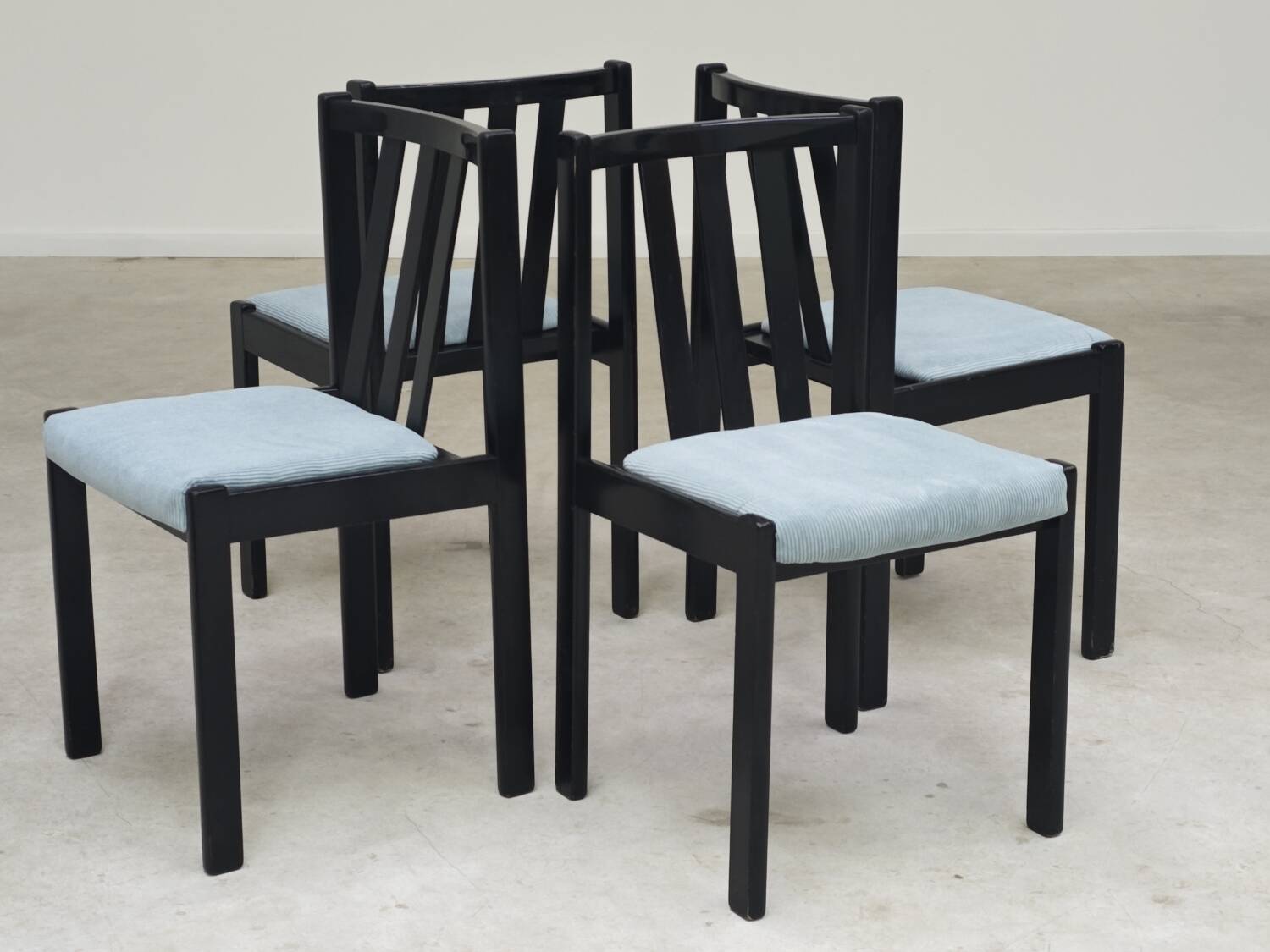 Set of 4 modernist black chairs with light blue ribbed fabric