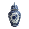 Delft vase "blue white" with floral motifs and surmounted by a dog.