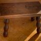 Footstool in varnished wood turns old