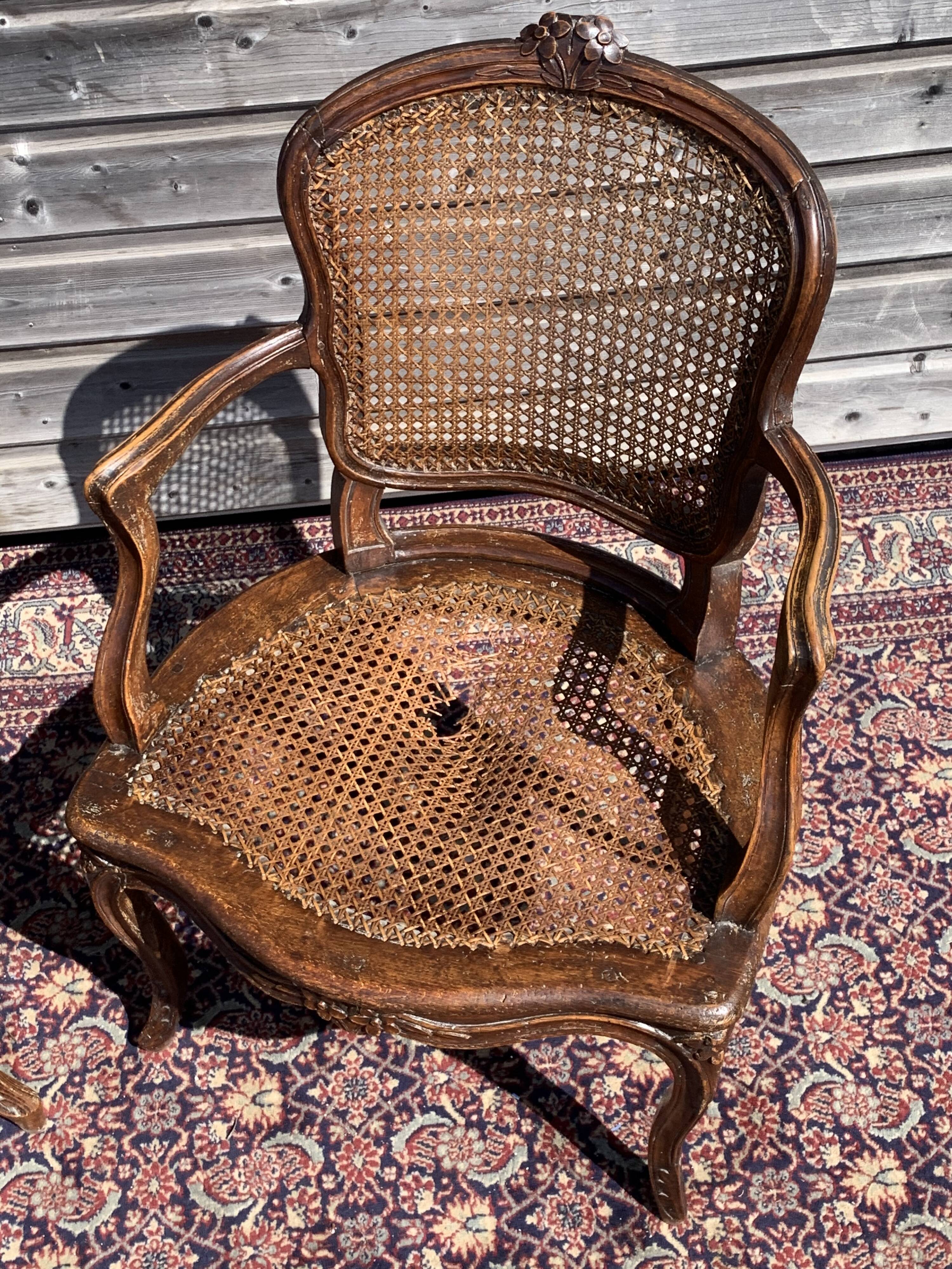 Pair of caned convertible armchairs Louis XV period