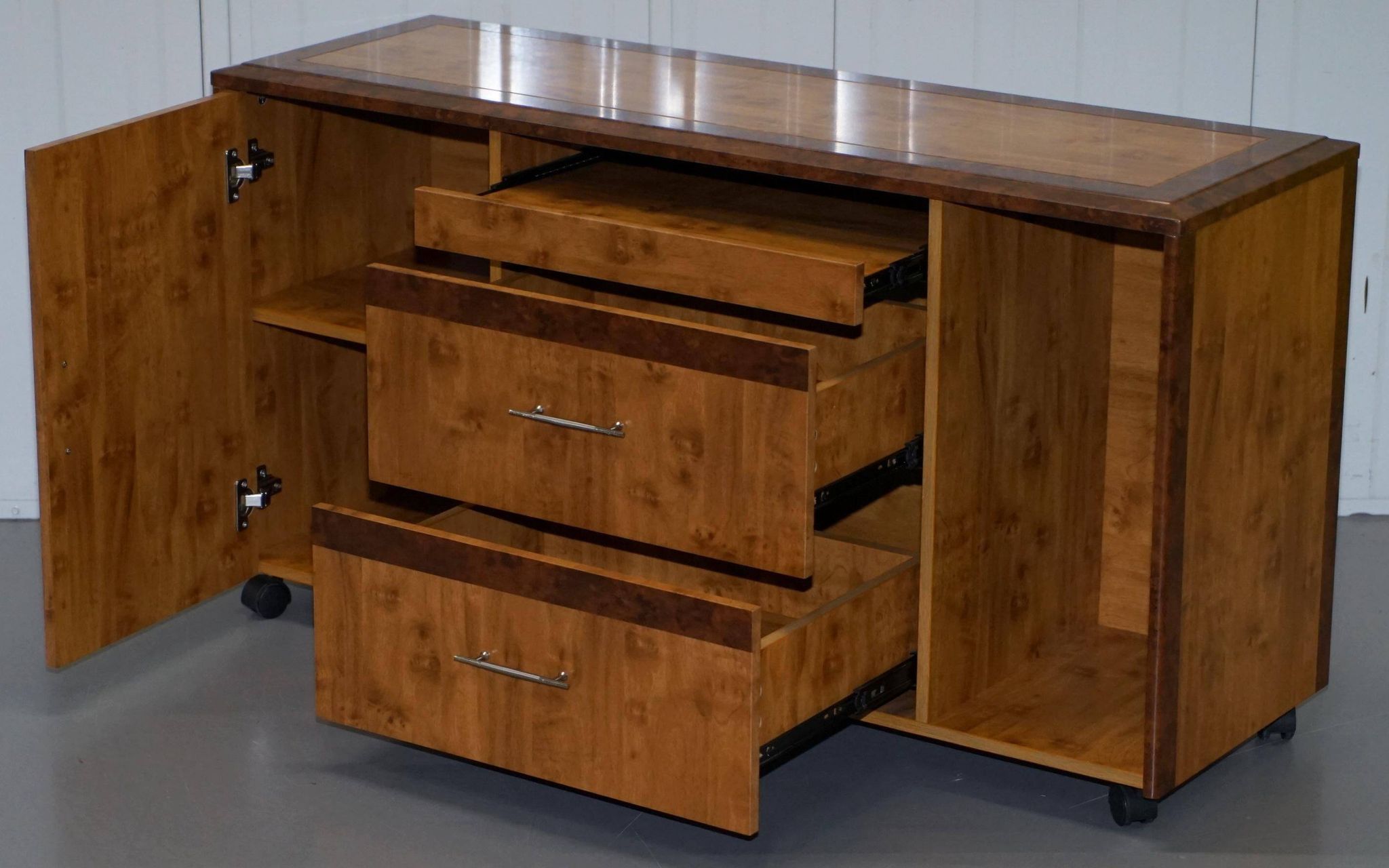 Walnut Burr buffet with drawers and wheels, part of a set.