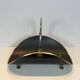 Neoclassical log holder in brass and black lacquered brass