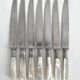 Antique table knives in mother-of-pearl and silver-plated metal