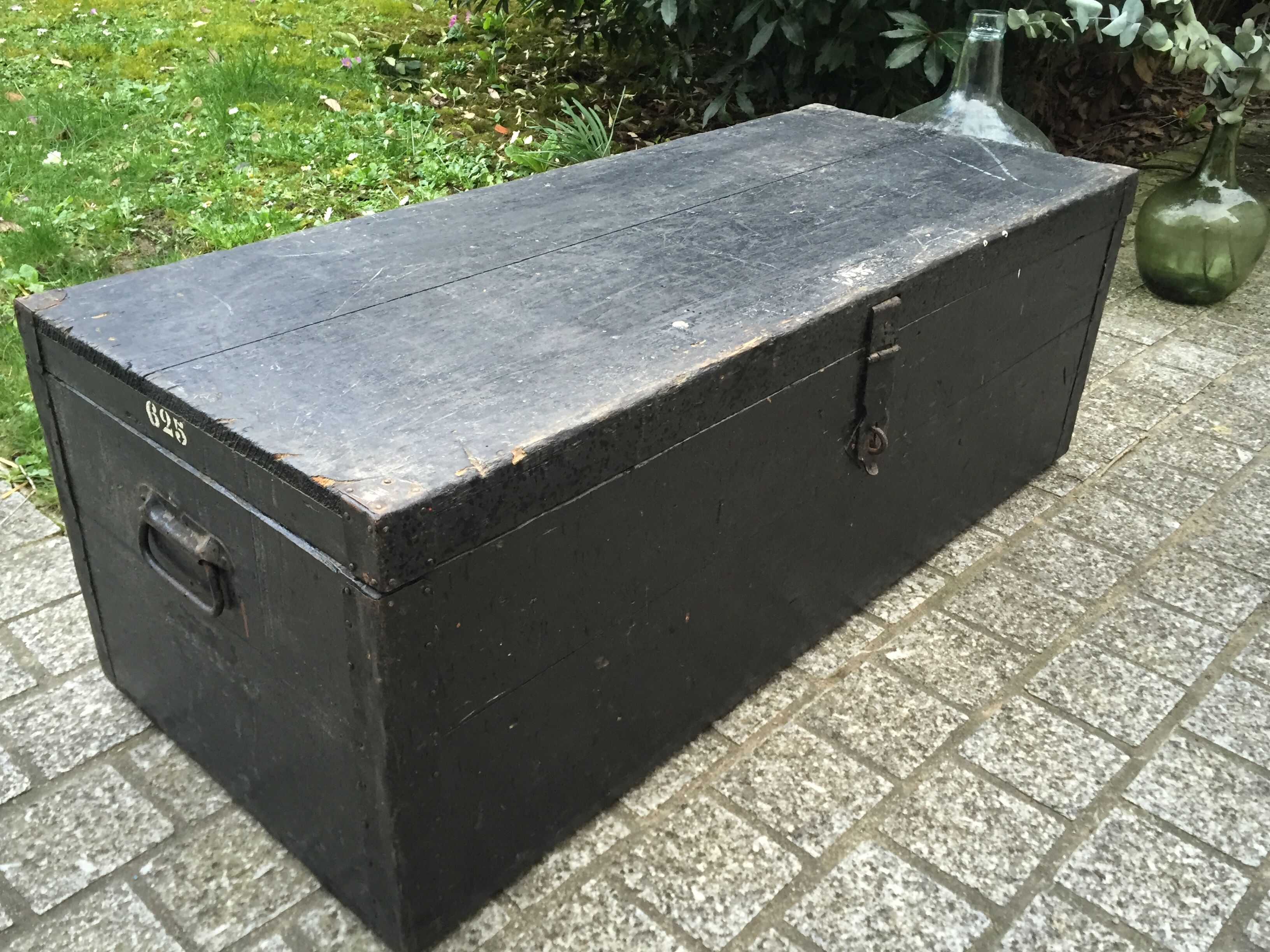 Old chest or wooden trunk black patina