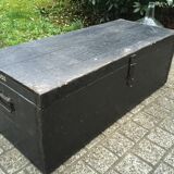 Old chest or wooden trunk black patina