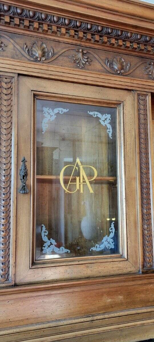 Two-body buffet, made of richly carved solid walnut.