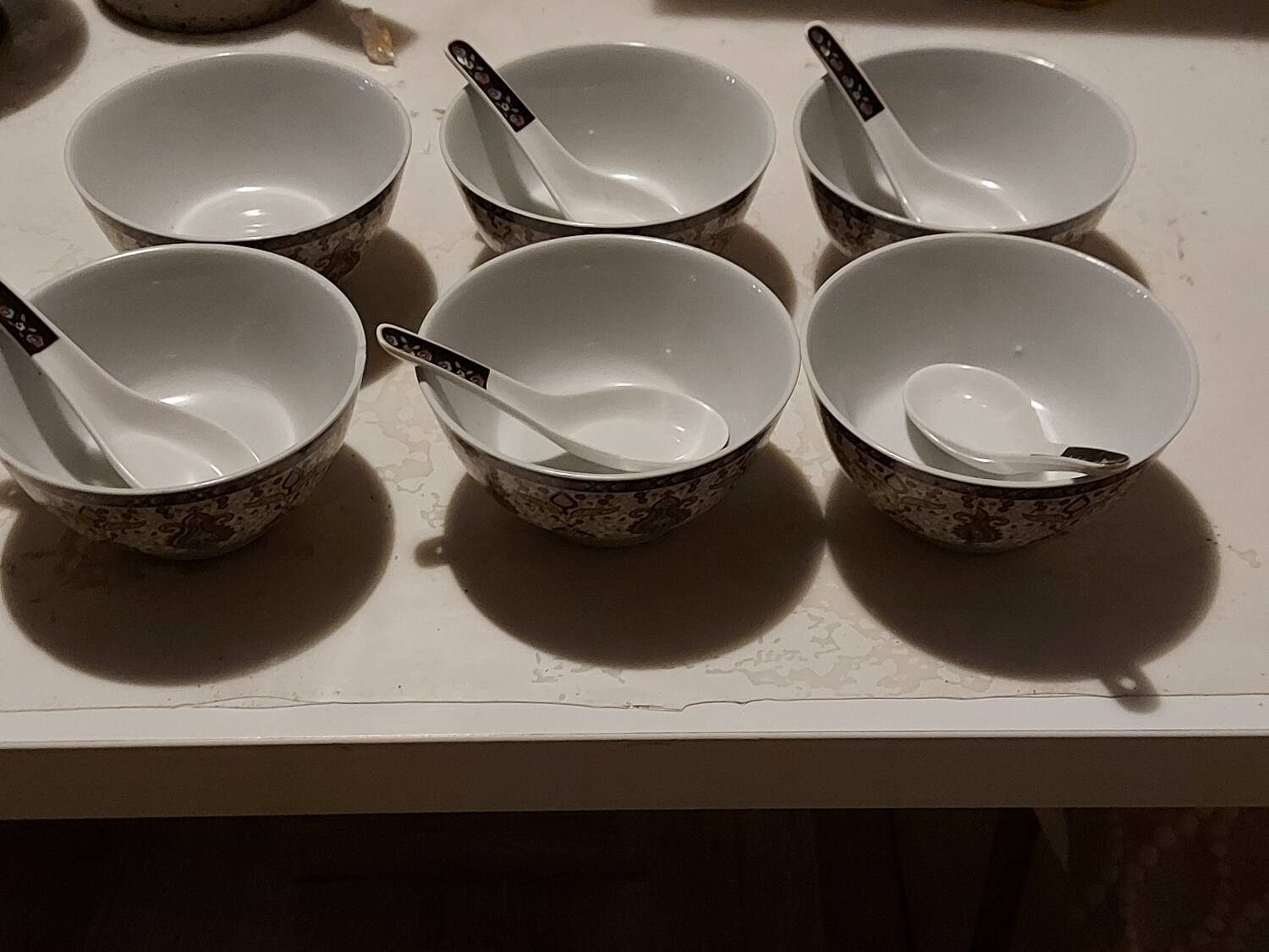 Set of oriental bowls and spoons
