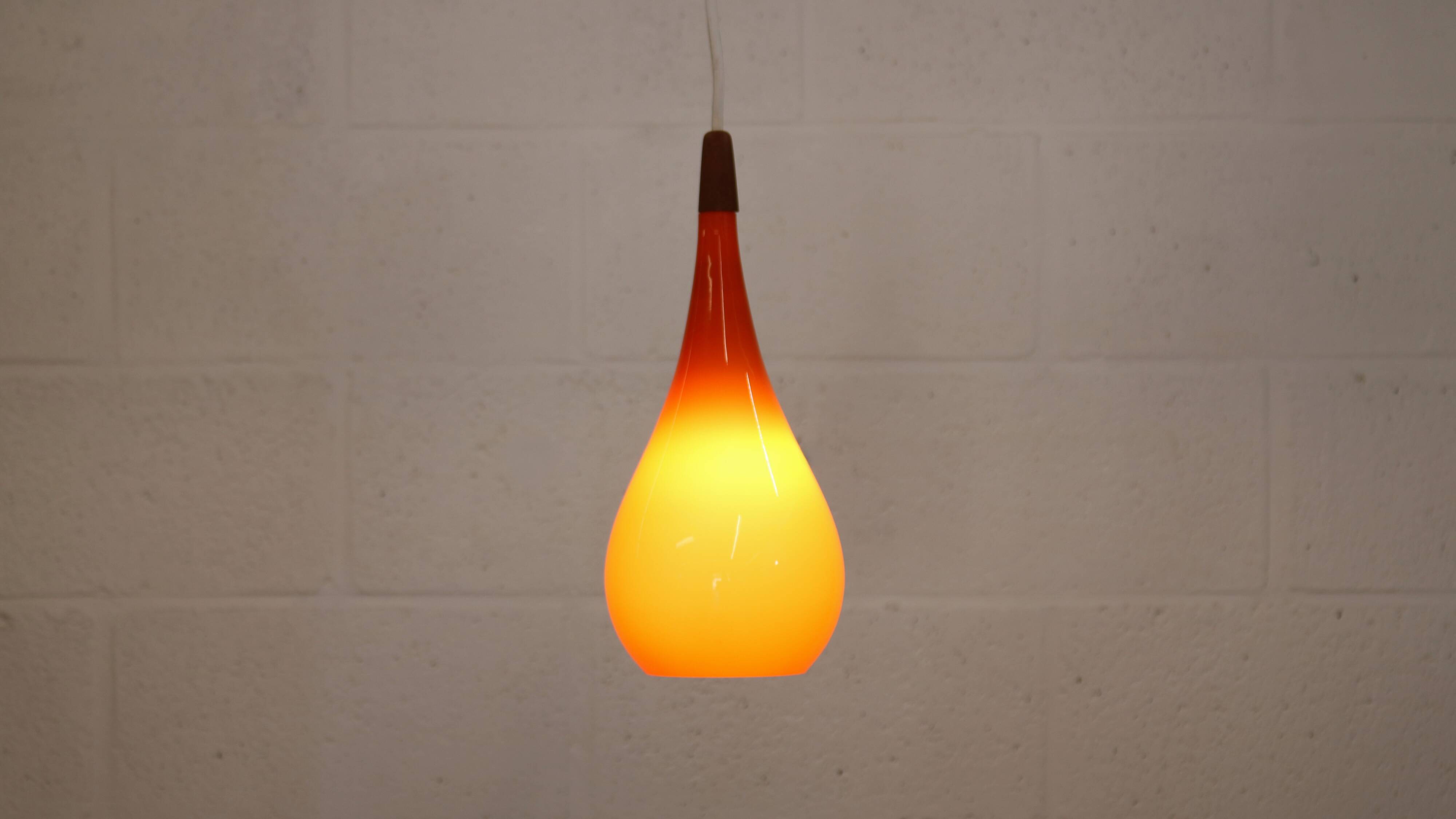 Orange teardrop glass pendant lamp made by Holmegaard - Denmark 1960