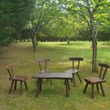Four chairs and brutalist coffee table