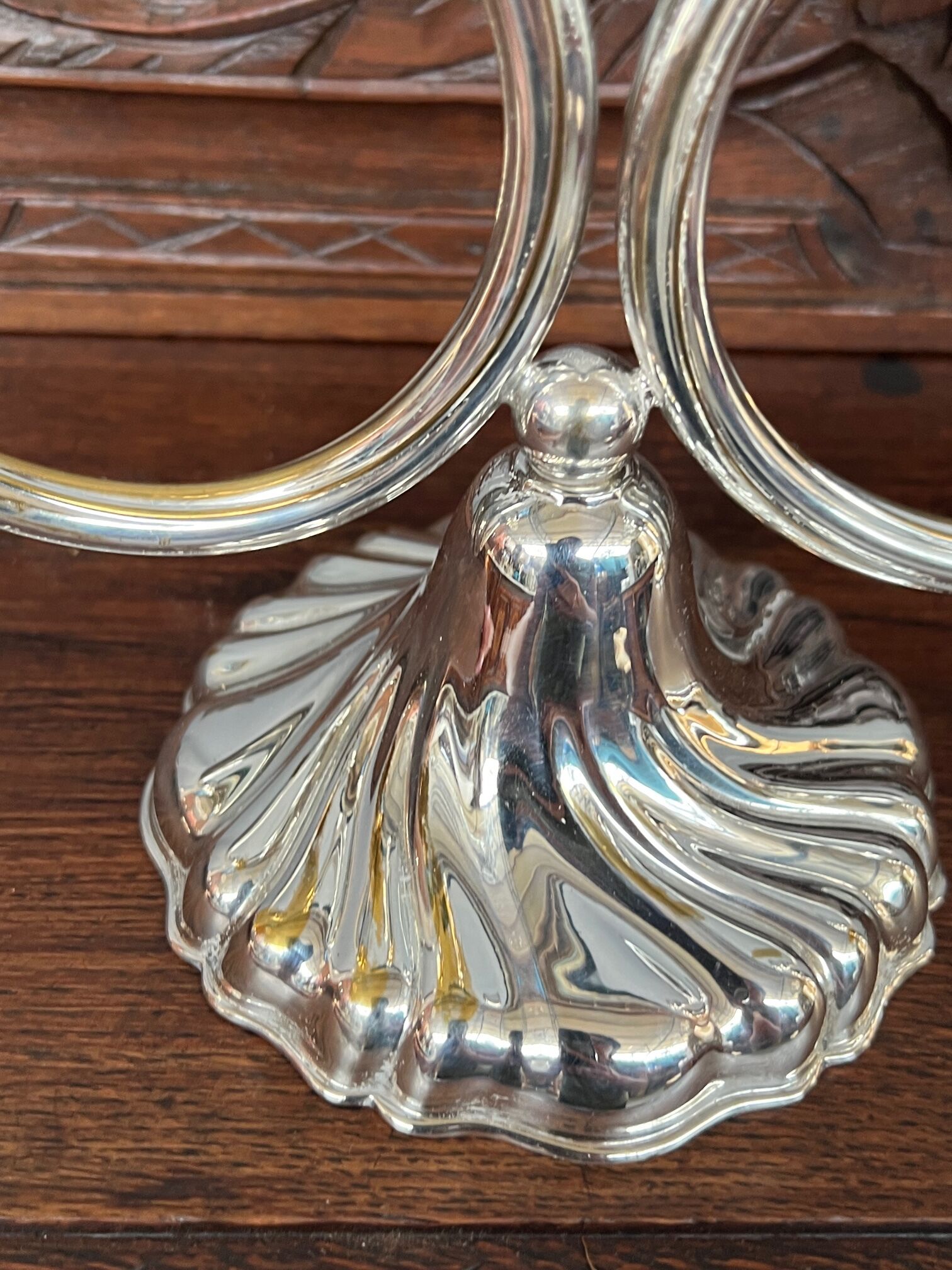 A pair of candlesticks. silver metal with gold decoration.