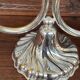 A pair of candlesticks. silver metal with gold decoration.