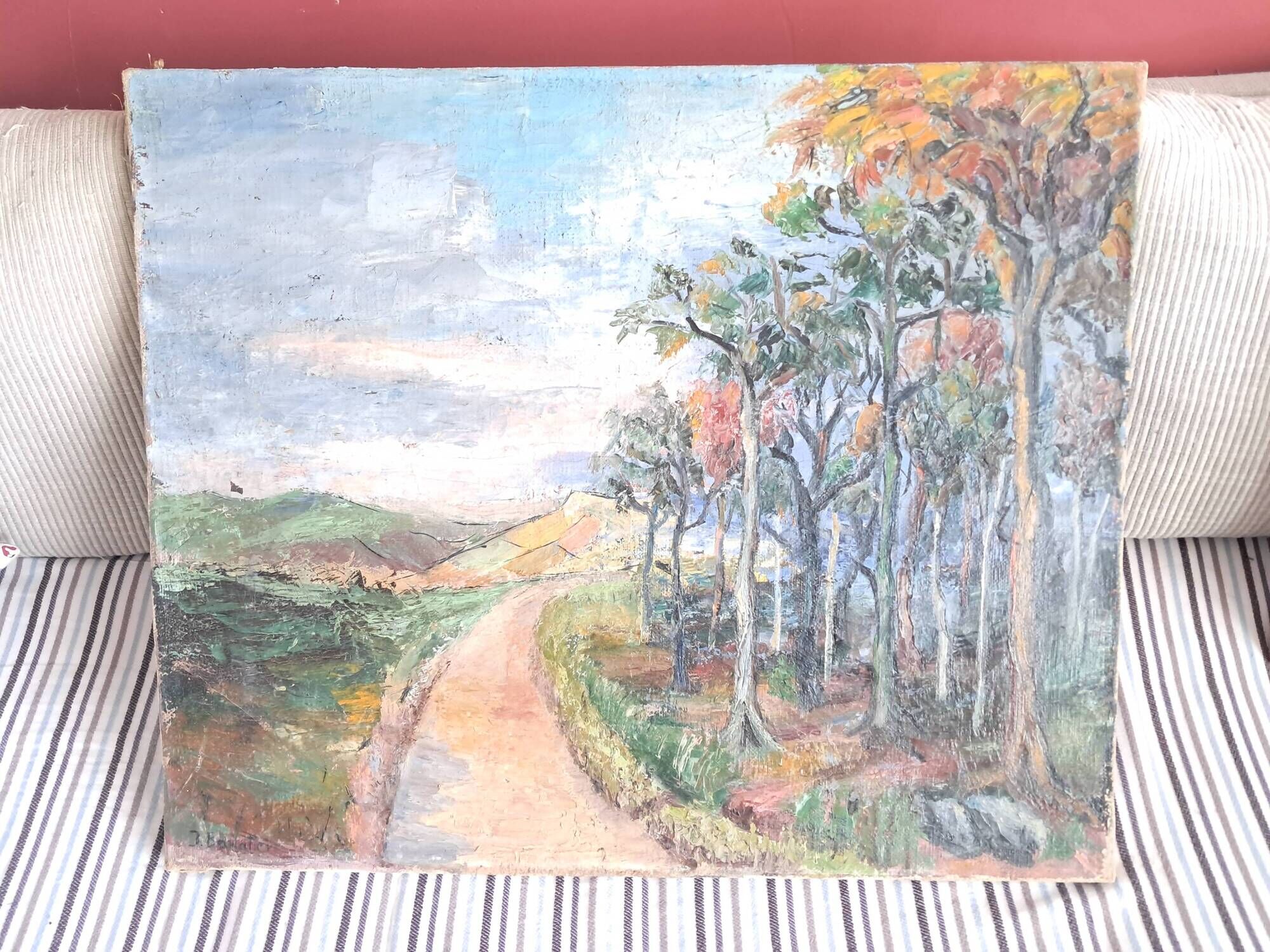 Large old oil painting depicting a landscape.