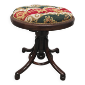 Antique curved wooden piano stool with kilim fabric from the 1910s.