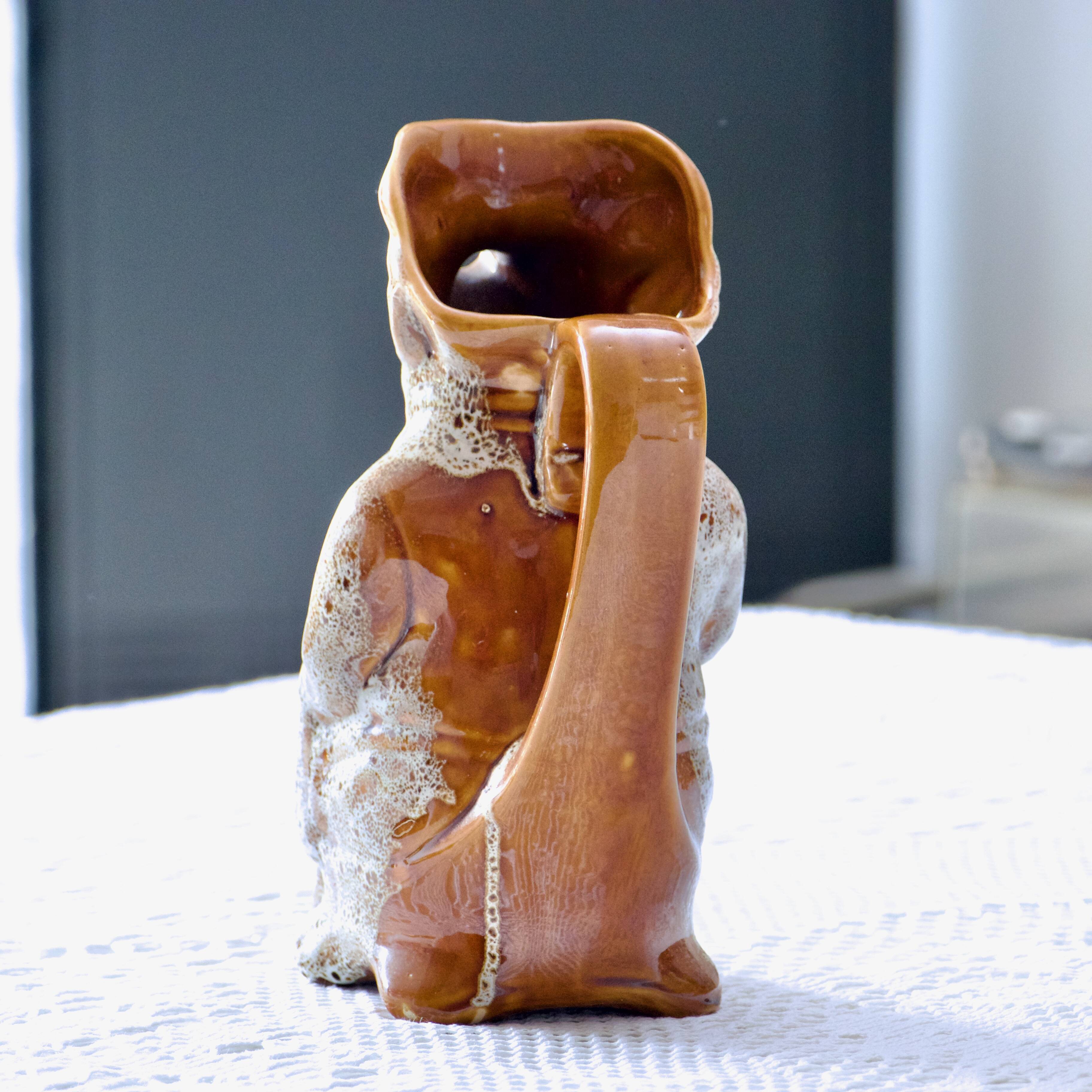 Antique zoomorphic pig carafe in foam-enameled stoneware