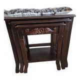 Nested tables made of varnished solid wood.