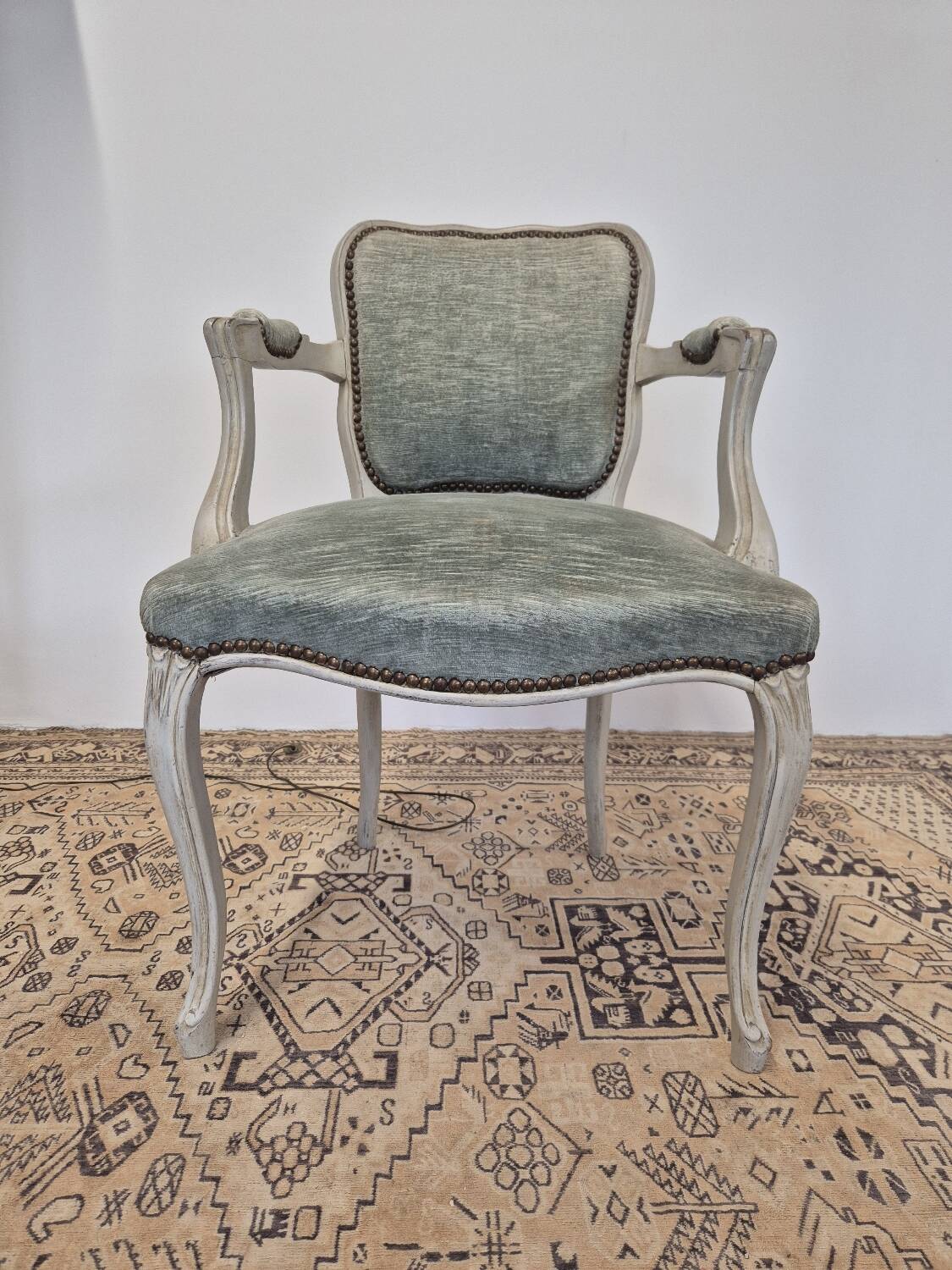 Louis XV style cabriolet armchair in patinated wood and velvet