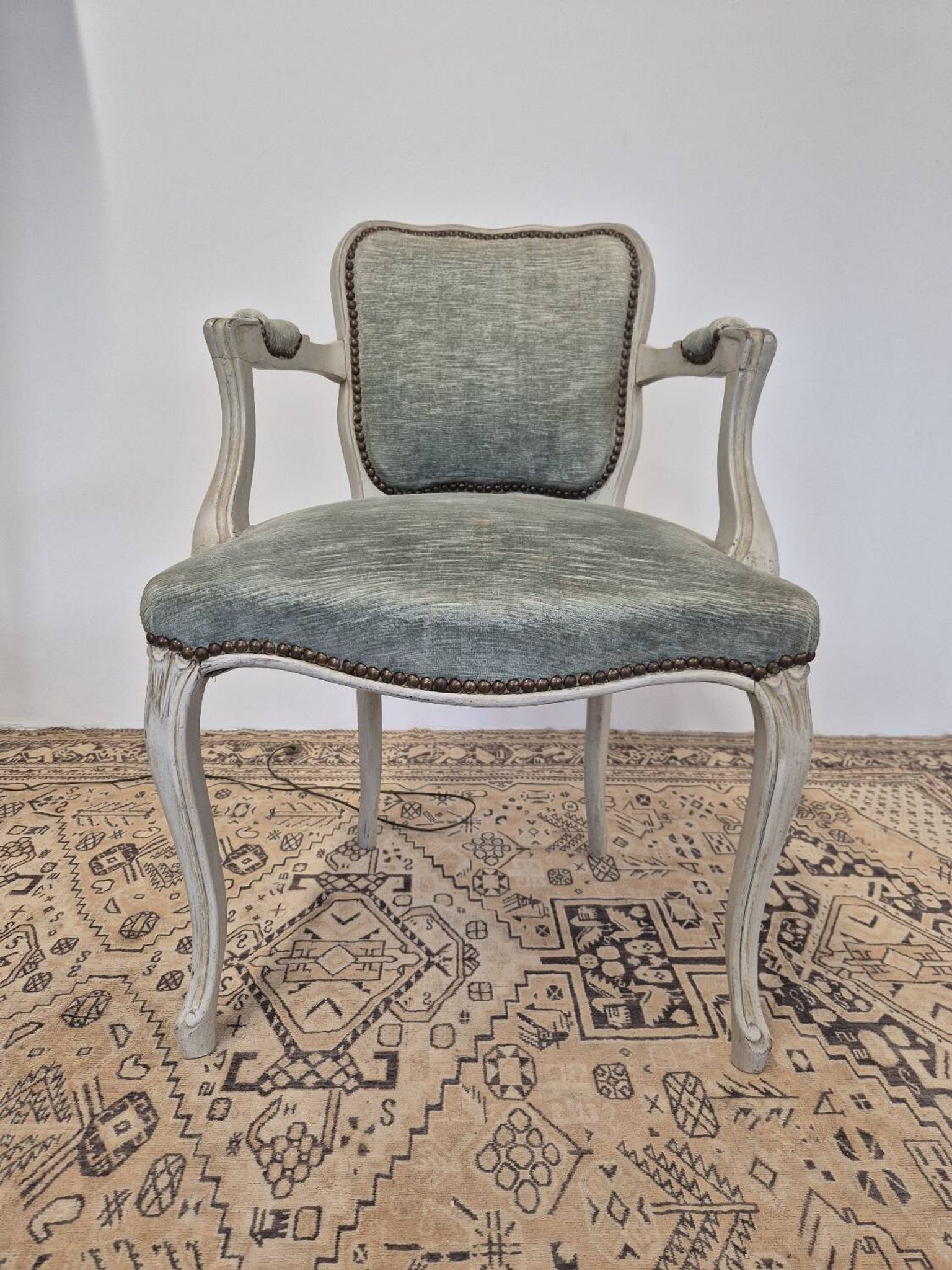 Louis XV style cabriolet armchair in patinated wood and velvet