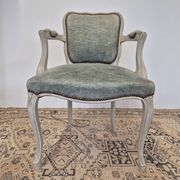 Louis XV style cabriolet armchair in patinated wood and velvet