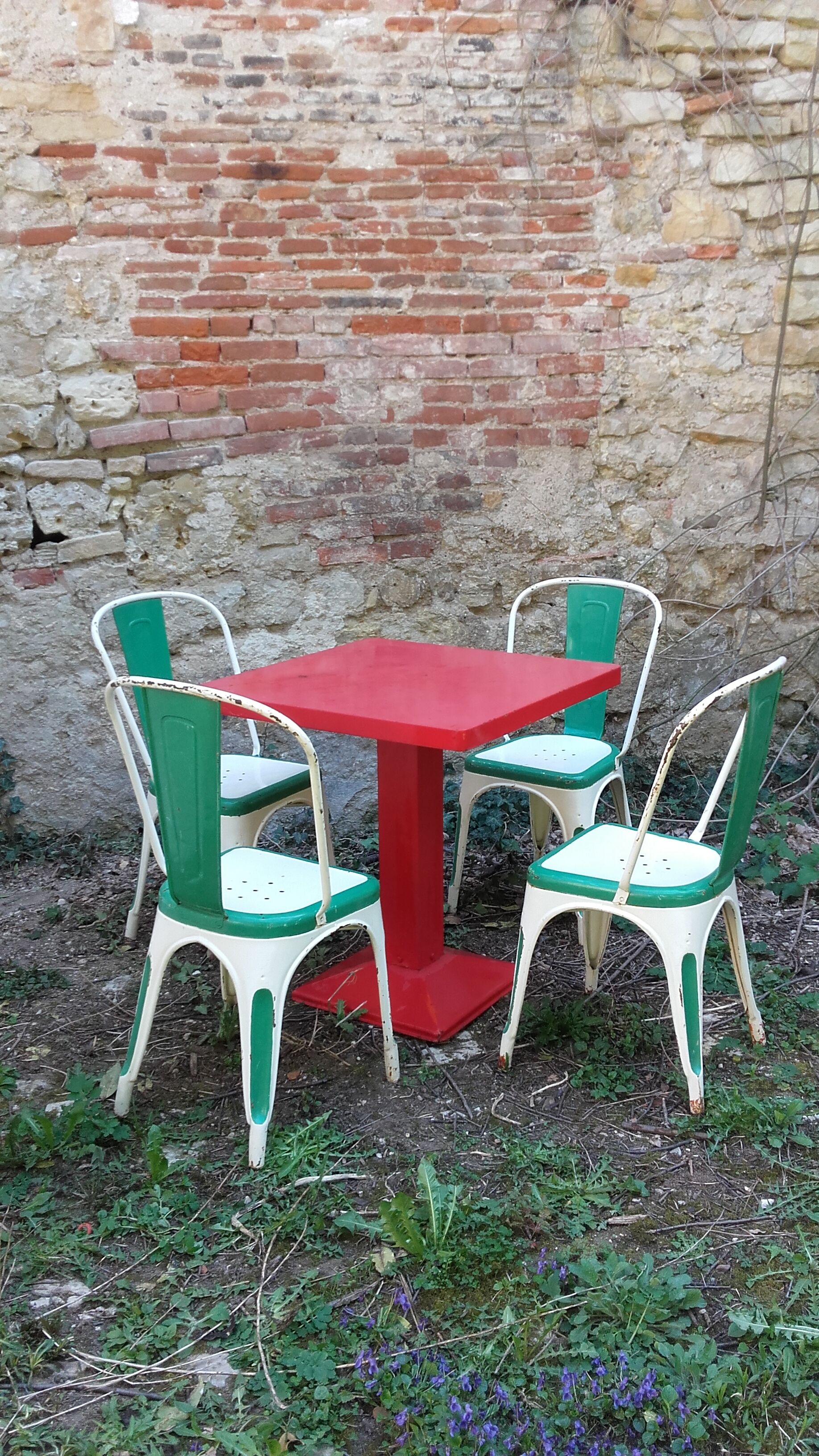 Four old Tolix Model A chairs