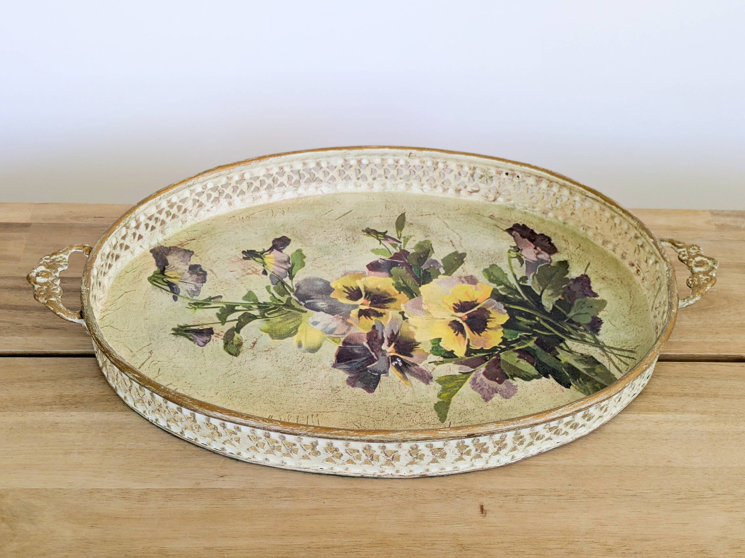 Oval metal decorative vintage tray with floral pattern.