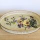 Oval metal decorative vintage tray with floral pattern.