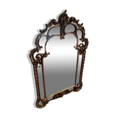 Antique mirror with rococo-style pareclose, in gilded wood, 19th century