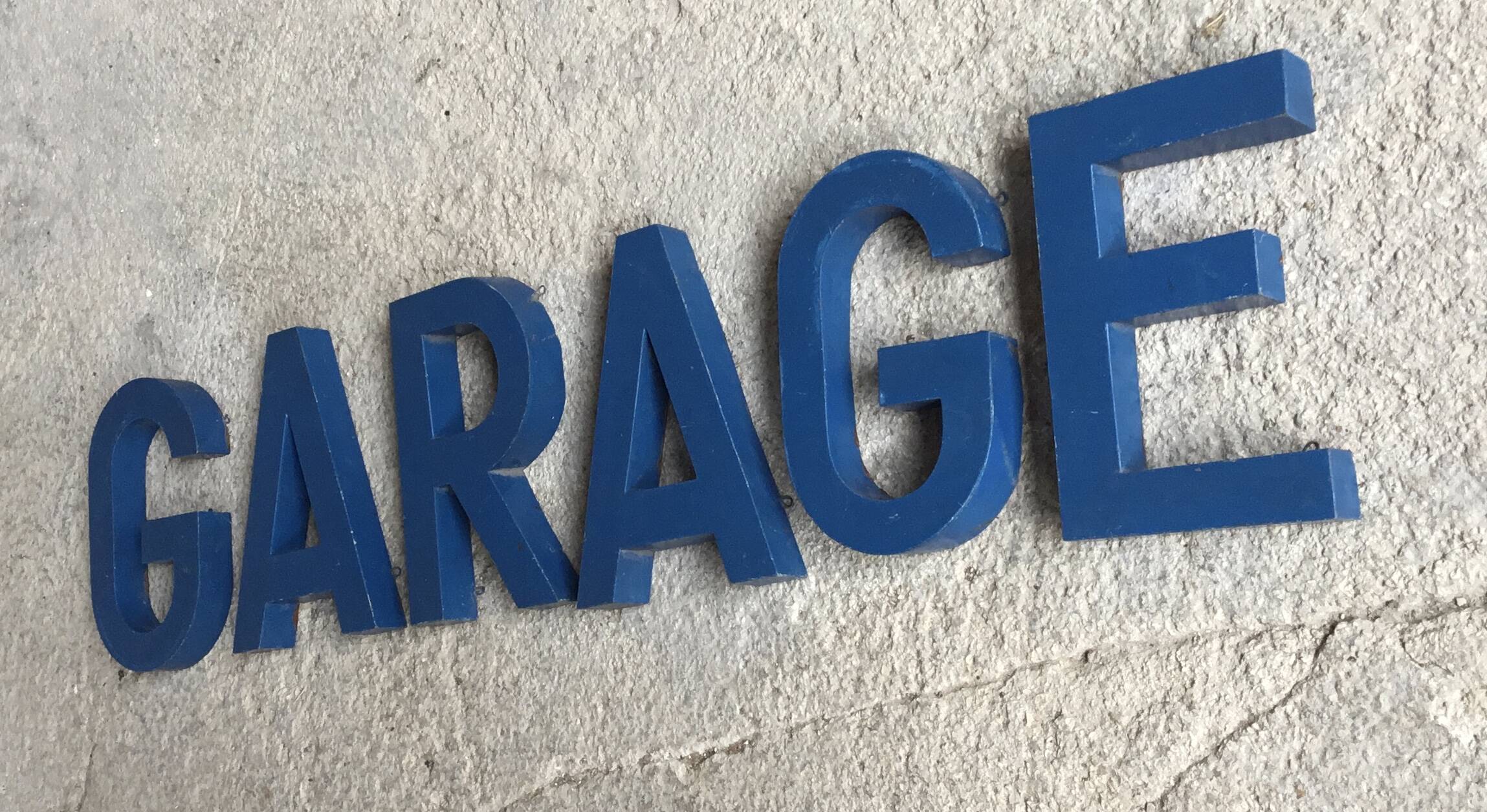 Metal sign letters forming the word GARAGE - vintage workshop