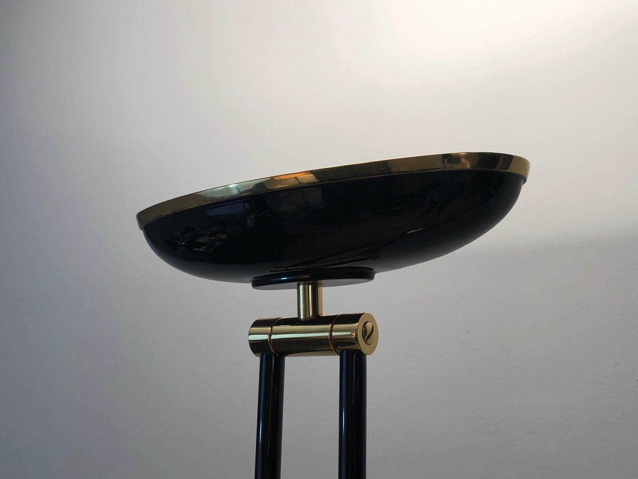 Black lacquered metal floor lamp with brass.