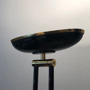Black lacquered metal floor lamp with brass.
