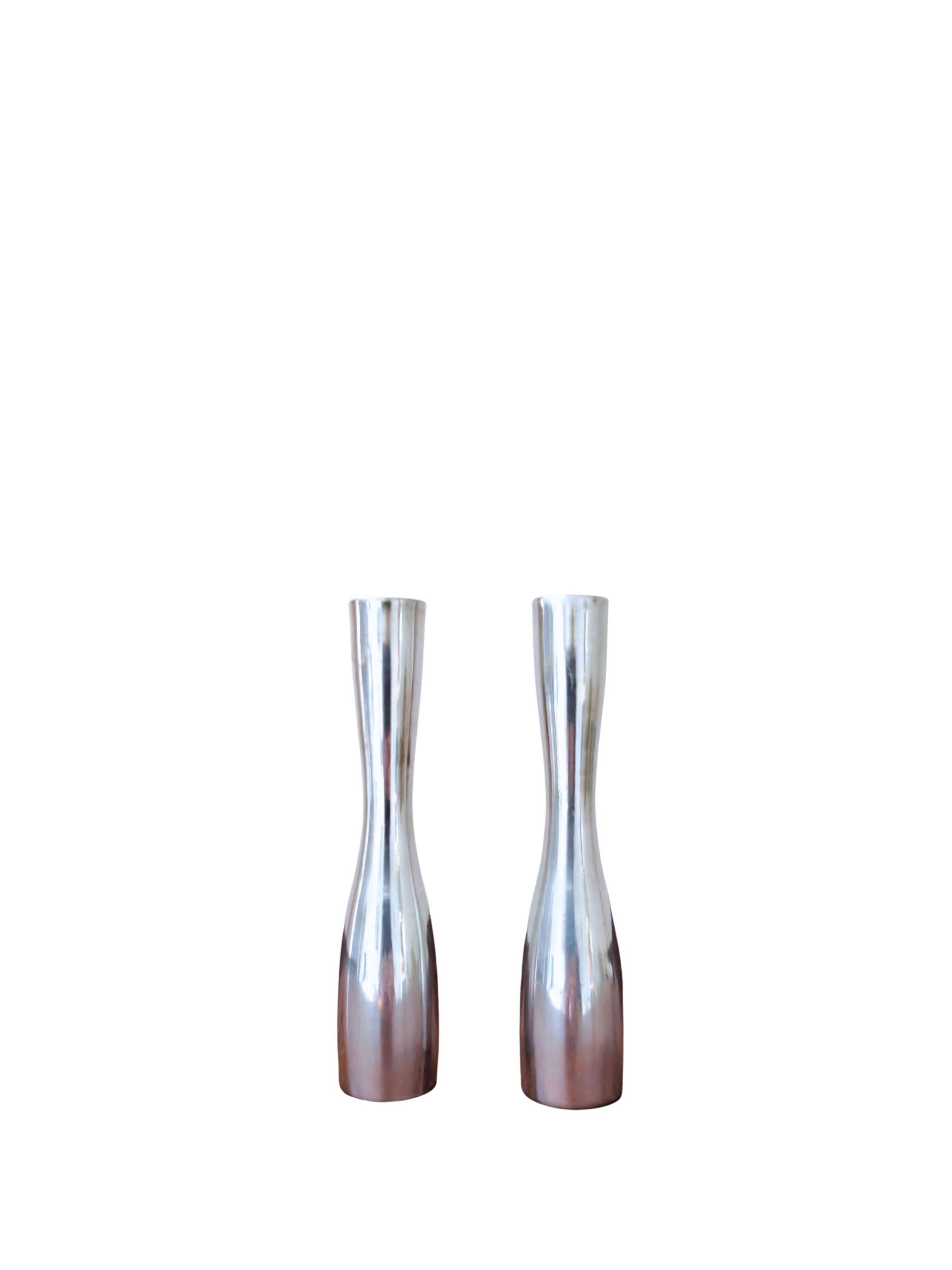 Pair of minimalist aluminium candlesticks in the style of Erika Pekkar.