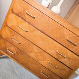Vintage chest of drawers with checkerboard and compass feet