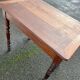 Wooden side table with turned legs