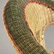Cabriolet style armchair in rattan, wicker and green and red edging