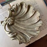 Bronze “shell” pocket emptier
