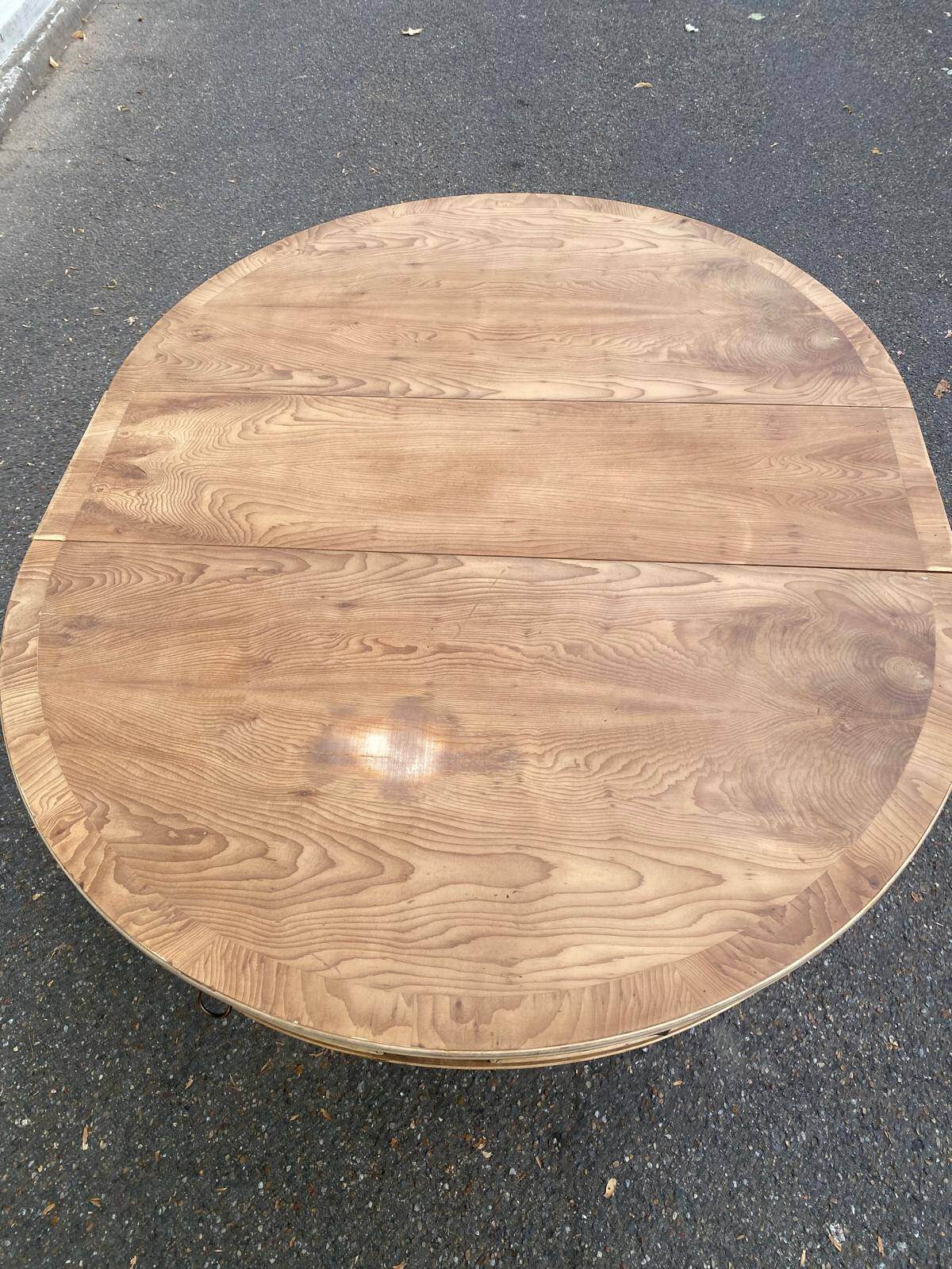 Round extendable dining table Regency central leg stripped mahogany 1960