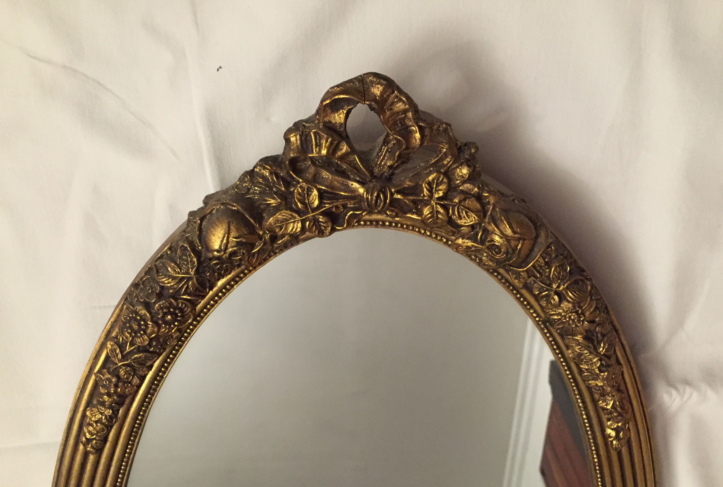 Miroir ovale en bois doré 85x43 cm