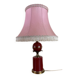 Art deco style desk lamp with a burgundy red sphere in the center the body is in lacquered iron