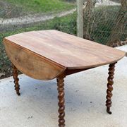 Louis Philippe oval table with shutters, 19th century, solid oak wood, twisted leg